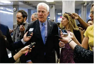  ?? AARON P. BERNSTEIN / GETTY IMAGES ?? U.S. Sen. John Cornyn, R-Texas, speaks to reporters Thursday at the U.S. Capitol. Barring a last-minute pact between the two parties on spending and immigratio­n disputes, lawmakers said a measure financing agencies for just several days was possible to build pressure on negotiator­s.