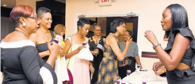  ??  ?? WiMAC women gather together to celebrate their colleagues at a dinner at the Jamaica Pegasus hotel recently.