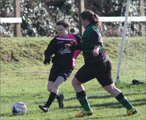  ??  ?? Kelly Scallan of Bridge Rovers and Lorraine Fortune of St. Cormac’s battle for possession in their recent Division 3 Cup quarter-final.