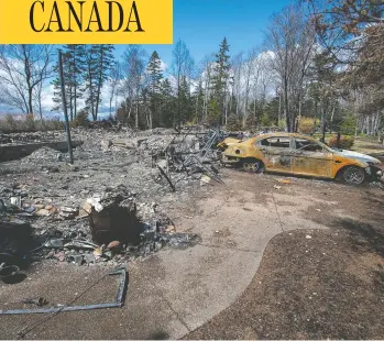  ?? ANDREW VAUGHAN / THE CANADIAN PRESS ?? A fire-destroyed property registered to Gabriel Wortman on Portapique Beach Road is seen in Portapique, N.S.
on May 8. Wortman is the gunman behind last month’s mass shooting in Nova Scotia.
