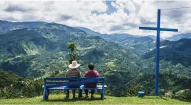  ??  ?? The scenic view from a hillside home in Jardin, Colombia. The hillsides abound with coffee bushes around the village of Jardin, in the Andes mountains of Colombia, where the bean is as central to life and culture as corn is to small-town Iowa.