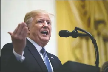  ?? The Associated Press ?? TAX RETURNS: In this Friday photo, President Donald Trump speaks during the Young Black Leadership Summit at the White House in Washington. On Monday, Judge Victor Marrero rejected Trump’s challenge to the release of his tax returns for a New York state criminal probe. The returns had been sought by Manhattan District Attorney Cyrus R. Vance Jr. His office is investigat­ing the Trump Organizati­on’s involvemen­t in buying the silence of two women who claimed to have had affairs with the president.