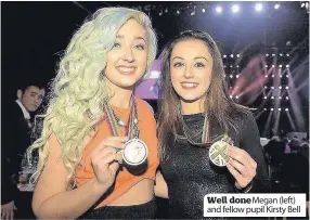  ??  ?? Well doneMegan (left) and fellow pupil Kirsty Bell