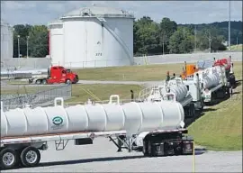  ?? Jay Reeves Associated Press ?? COLONIAL Pipeline Co. says it transports more than 100 million gallons of fuel a day through its pipeline system. Above, a company facility in Pelham, Ala., in 2016.