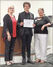  ?? kevin Myrick ?? Evan Holder will represent the Polk School District at the Governor’s Honors Program this summer in Music, with a focus on Percussion. The sophomore was joined in the photo by School Board Vice Chair Kristy Gober and Superinten­dent Laurie Atkins.