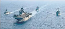  ?? REUTERS ?? A file photo of Australian and American navy ships in the disputed waters of the South China Sea. n