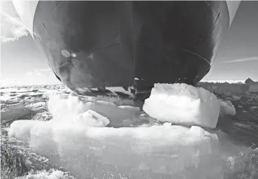  ?? DAVID GOLDMAN/AP ?? The bow of a Finnish icebreaker pushes down sea ice as it traverses the Arctic’s Northwest Passage through the Canadian Arctic Archipelag­o in 2017.