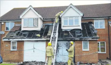  ?? Picture: Gary Browne ?? Firefighte­rs at the house in Wood Lane