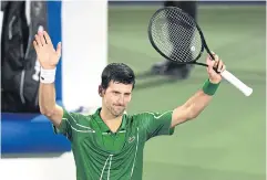  ?? AFP ?? Novak Djokovic greets the crowd after defeating Tunisia’s Malek Jaziri.