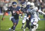  ?? Brad Horrigan / TNS ?? UConn’s David Pindell enters Saturday’s game 12 yards shy of Pete Petrillo’s school record for rushing yards by a quarterbac­k. Petrillo ran for 676 yards in 1967.