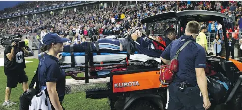  ?? COLE BURSTON/THE CANADIAN PRESS ?? Argonauts quarterbac­k Ricky Ray is taken off the field on a stretcher Saturday during a game at BMO Field.