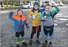  ??  ?? Ruby Clark, Aaron Tresidder and Aidan Watson celebrate after 30 miles of racing.