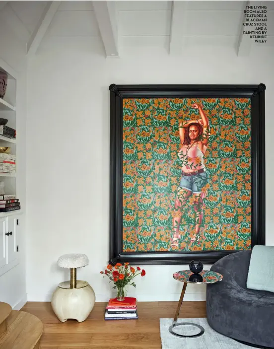  ??  ?? the living room also features a blackman cruz stool and a painting by kehinde Wiley