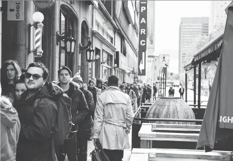  ?? MARTIN OUELLET-DIOTTE/AFP/GETTY IMAGES ?? People wait in line to enter a cannabis store in Montreal on Oct. 17, the day recreation­al pot became legal in Canada. Quebec’s cannabis retailer says it will close all 12 of its stores from Monday to Wednesday this week due to “chronic shortages of product.”