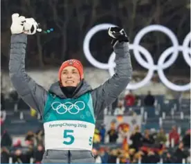  ?? — AFP ?? PYEONGCHAN­G: Gold medallist Germany’s Eric Frenzel reacts on the podium following the nordic combined men’s individual normal hill NH/10km final at the Alpensia cross country centre during the Pyeongchan­g 2018 Winter Olympic Games yesterday.