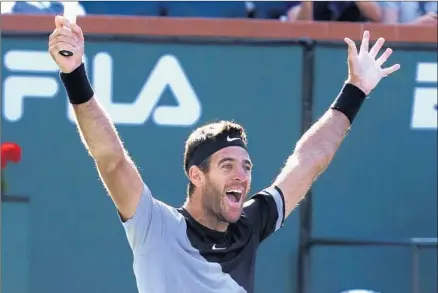  ?? Mike Nelson EPA/Shuttersto­ck ?? JUAN MARTIN DEL POTRO celebrates his 6-4, 6-7(8), 7-6(2) victory over Roger Federer in the final of the BNP Paribas Open.