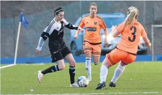  ??  ?? Jeanfield’s Megan Moss runs at the Glasgow City defence.