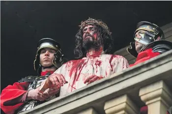  ?? GETTY IMAGES ?? A recreation of the final hours of Christ in Poland, on Good Friday in 2022. As an account of man’s inhumanity to man, the Easter story is a brutal read, writes Andrew Shepherd.