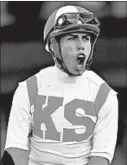  ?? MARK J. TERRILL/AP ?? Irad Ortiz Jr. lets out a yell after riding Bricks and Mortar to a win Saturday at the Breeders' Cup Turf race.