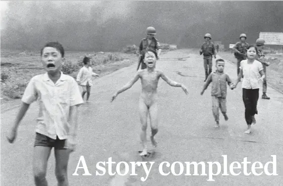  ?? THE ASSOCIATED PRESS ?? Photograph­er Huynh Cong (Nick) Ut captured this image of terrified children, including Kim Phuc, centre, running down Route 1 near Trang Bang in Vietnam after a napalm attack on June 8, 1972.