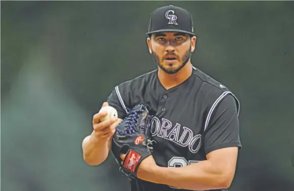  ?? John Leyba, The Denver Post ?? Rockies starting pitcher Chad Bettis takes the mound in the first inning against the Atlanta Braves on Monday night at Coors Field in his first game back from cancer treatment. He pitched superbly and got great defense behind him, going seven shutout...