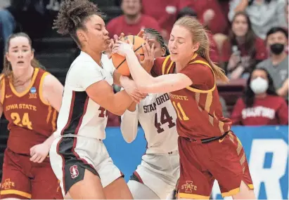  ?? THEARON W. HENDERSON/GETTY IMAGES ?? Iowa State’s Emily Ryan, right, battles for the ball with Courtney Ogden of Stanford during their NCAA Tournament game Sunday in Stanford, Calif. Ryan scored a career-high 36 points in the Cyclones’ 87-81 overtime loss.