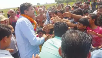  ??  ?? Former Biju Janata Dal leader Baijayant Panda interactin­g with voters in his constituen­cy in a bid to maintain his hold over his supporters.