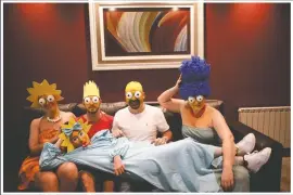  ??  ?? The Arevalo-Robledo family, dressed as The Simpsons, poses for a photo in their living room on June 27. Mariano Arevalo is Homer, Mariel Robledo is Marge, Federico Garozzo is Bart, Julieta is Lisa and Camila Arevalo is Maggie. This family said every day of lockdown started to look the same, so they decided every Saturday to dress in different costumes to combat boredom and put some humor into their lives.