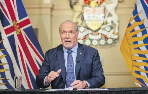  ?? DARREN STONE, TIMES COLONIST ?? Premier John Horgan at the legislatur­e on Wednesday: “It won’t be the flipping of a switch. We’re going to be proceeding carefully.”