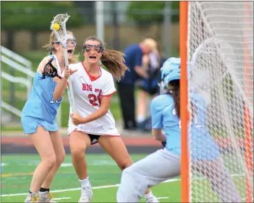  ?? KYLE FRANKO — TRENTONIAN PHOTO ?? Lawrencevi­lle’s Lexi Koch, center, shoots and scores past the defense of Notre Dame’s Kate Martinek, left, and goalie Emily Brady, right, during a Mercer County Tournament semifinal girls lacrosse game on Wednesday afternoon at Allentown High.