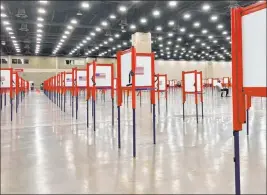  ?? Piper Blackburn The Associated Press ?? Voting stations are set up Monday for the primary election at the Kentucky Exposition Center in Louisville, Ky. Only one polling place is designated for Louisville on Tuesday.