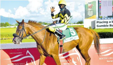  ?? FREELANCE PHOTOGRAPH­ER ANTHONY MINOTT/ ?? ATOMICA, ridden by Robert Halledeen, wins the Jamaica Cup over nine-and-half furlongs, a graded stakes for horses three years old and upwards at Caymanas Park on Saturday, November 11, 2023.