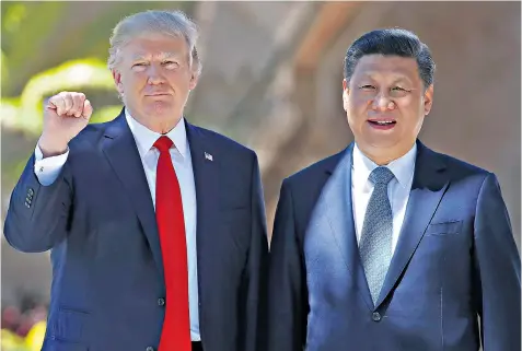  ??  ?? President Donald Trump, pictured with President Xi Jinping in Florida last month, has drawn back from the forceful rhetoric against China of his election campaign
