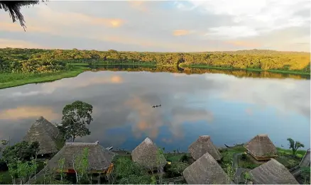  ?? JUSTINE TYERMAN ?? The lake at sunset from the top of the observatio­n tower at the eco-lodge.