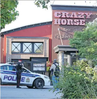  ?? JEAN LEVAC ?? Gunfire erupted outside the Crazy Horse bar in Kanata early Thursday, wounding two men. At least nine shots were fired in what is being described as a drive-by shooting that remains under investigat­ion.