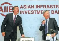  ?? ZHANG WEI / CHINA DAILY ?? Jin Liqun, president of the Asian Infrastruc­ture Investment Bank, and Canadian Finance Minister Bill Morneau attend a news conference in Beijing on Wednesday.