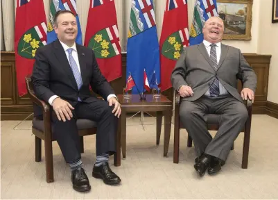  ?? CHRIS YOUNG THE CANADIAN PRESS FILE PHOTO ?? While Alberta Premier Jason Kenney, left, who had merged the former provincial Progressiv­e Conservati­ve and Wild Rose parties into the United Conservati­ve Party, was trying to appease right-wingers internally, Doug Ford shunned them — but only after getting burned.