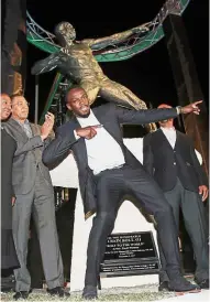  ?? — Reuters ?? Spitting image: Usain Bolt posing in front of his statue at Kingston’s National Stadium in Jamaica on Sunday.