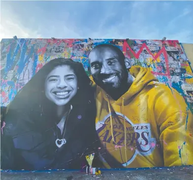  ?? CHRIS DELMAS / AFP VIA GETTY IMAGES FILES ?? A mural by French artist Mr. Brainwash of Kobe Bryant and his daughter Gigi in Los Angeles.