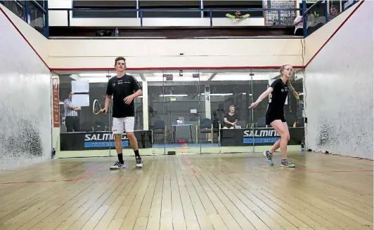  ?? PHOTO: DAVID UNWIN/STUFF ?? Palmerston North squash players Richard Bell, left, and Kaitlyn Watts are attempting to set a world record of playing for 40 hours.