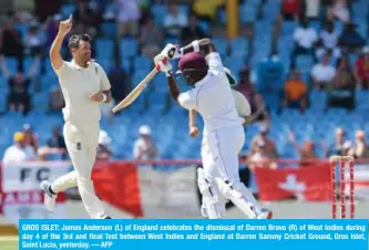  ??  ?? GROS ISLET: James Anderson (L) of England celebrates the dismissal of Darren Bravo (R) of West Indies during day 4 of the 3rd and final Test between West Indies and England at Darren Sammy Cricket Ground, Gros Islet, Saint Lucia, yesterday. — AFP