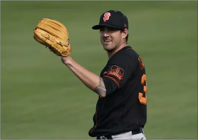  ?? JAE C. HONG — THE ASSOCIATED PRESS ?? Although he hasn’t yet pitched in a Cactus League game, all indication­s are that the Giants’ Kevin Gausman will be ready for Opening Day.