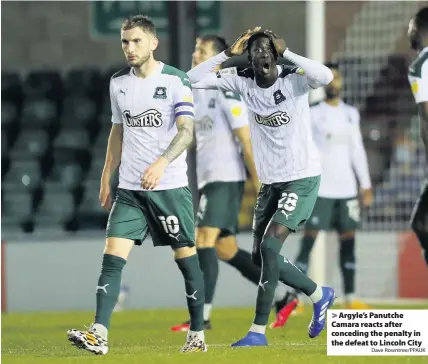  ?? Dave Rowntree/PPAUK ?? > Argyle’s Panutche Camara reacts after conceding the penalty in the defeat to Lincoln City