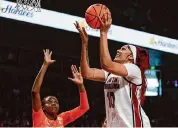  ?? Nell Redmond/Associated Press ?? South Carolina’s Kamilla Cardoso, right, shoots over Tennessee’s Jillian Hollingshe­ad in Sunday’s victory.