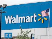  ?? [PHOTO BY TIMOTHY FADEK, BLOOMBERG] ?? An American flag flies outside of a Walmart Inc. store in Secaucus, New Jersey.