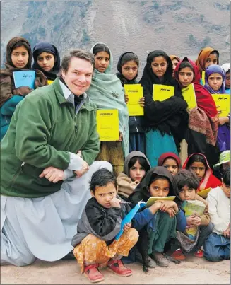  ??  ?? Central Asia Institute co-founder and author Greg Mortenson with Nowseri schoolchil­dren in the Azad Kashmir area of Pakistan. Mortenson, nominated for Nobel Peace Prize for his work building schools in Afghanista­n and Pakistan, will resign from the...