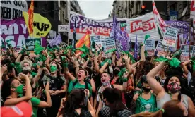  ??  ?? Demonstrat­ors in green headscarve­s celebrate outside the congress building in Buenos Aires on Friday. Photograph: Ronaldo Schemidt/AFP/Getty