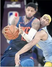  ?? Robert Gauthier Los Angeles Times ?? THUNDER FORWARD Paul George tries to keep the ball away from Lakers forward Corey Brewer in the first half. George scored 24 points in 27 minutes.