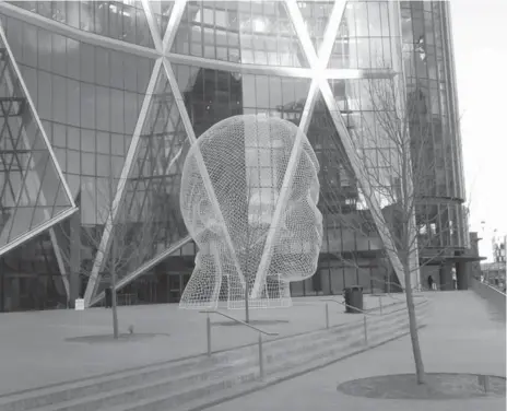  ?? KEN MELANSON PHOTO ?? Jaume Plesa’s Wonderland statue, above, was unveiled in late January. His Crown Fountain, left, has adorned Chicago’s Millennium Park since 2004.