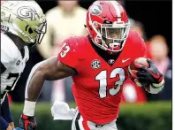  ?? AP file photo ?? Running back Elijah Holyfield, who chose the NFL Draft over returning for his senior season at Georgia, hopes the traits he inherited from his father, former four-time boxing champion Evander Holyfield, will help him overcome the negative of his slow 40-yard times.